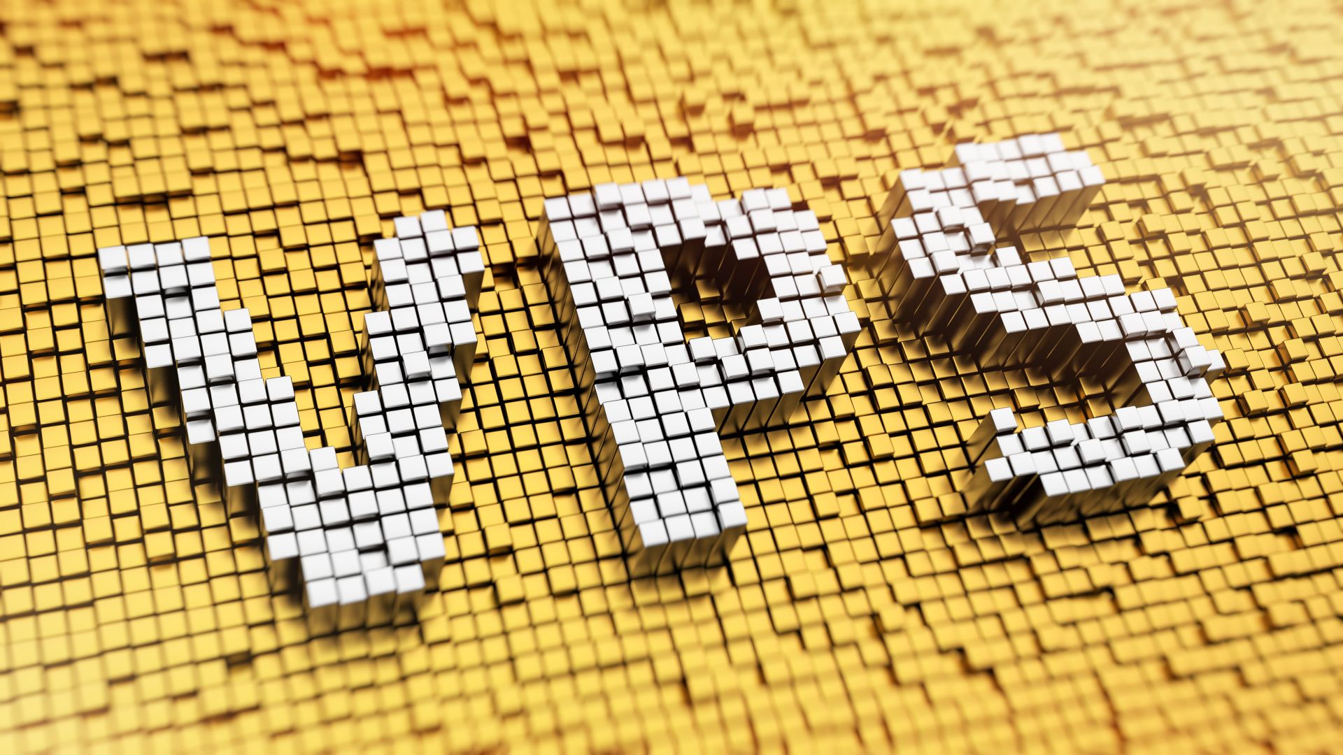 Duży biały napis VPS na żółtym tle ułożony z klocków 3D.